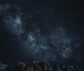 Star-filled night sky over mountains Starry sky with Milky Way over mountains